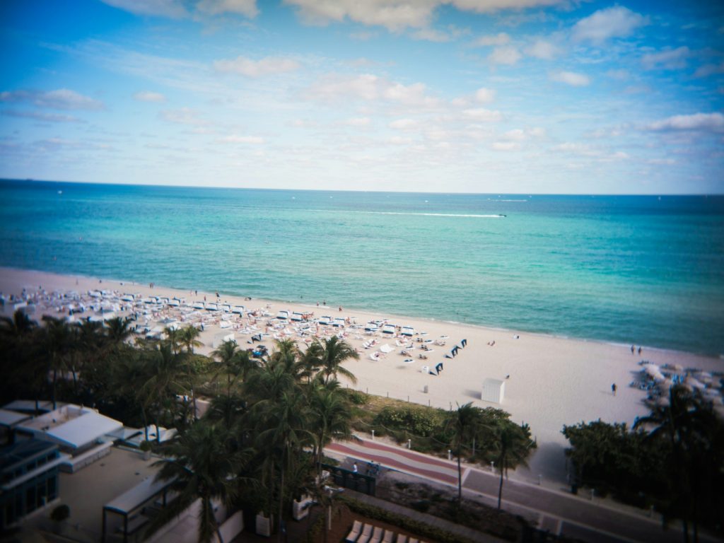 The beach and its umbrellas seen from an upper floor