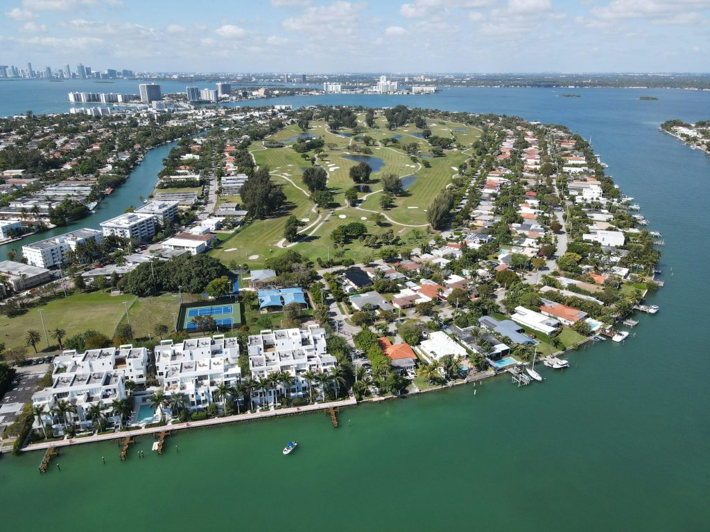 An island neighborhood built around a golf course, the city on the horizon