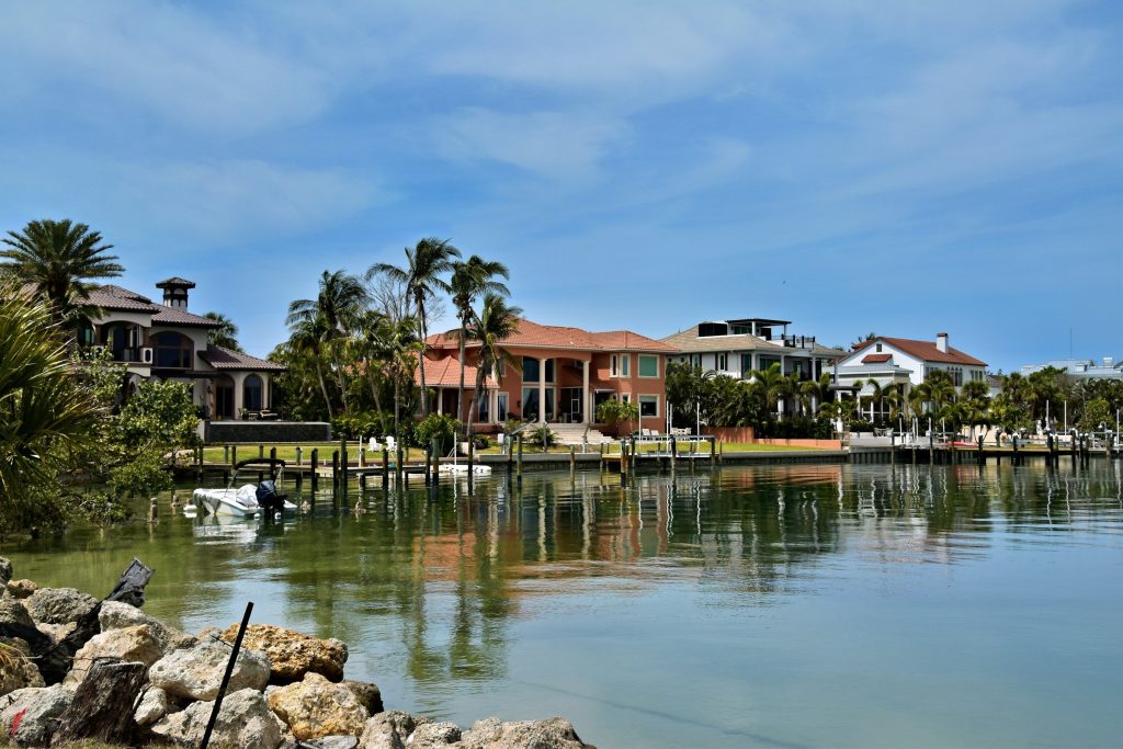 Waterfront houses with private docks across a sheltered basin