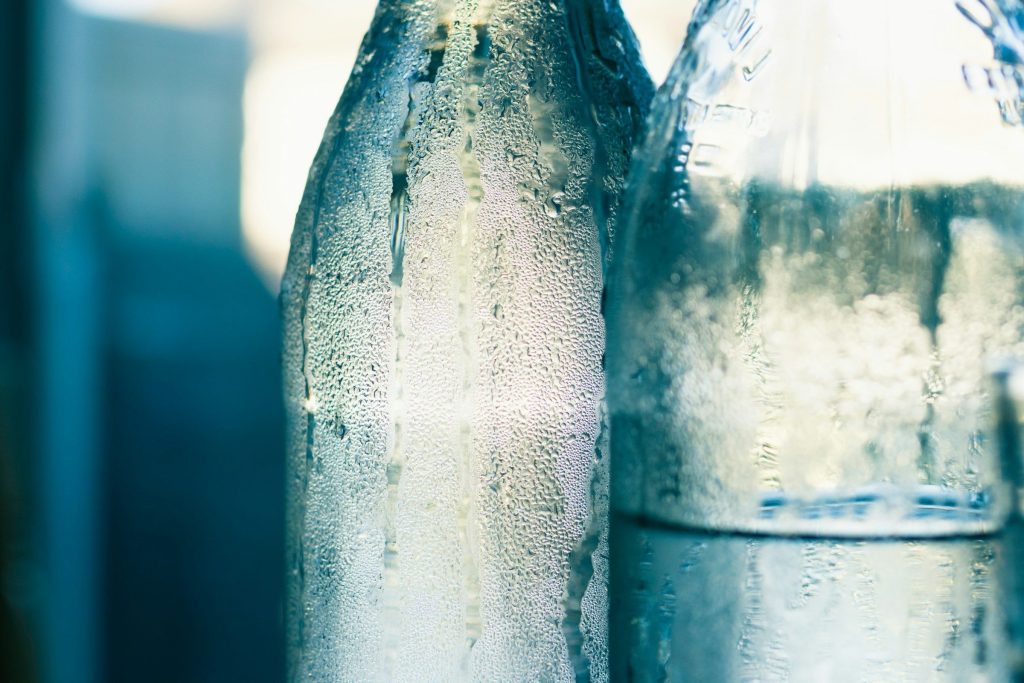 Condensation running down chilled glass bottles